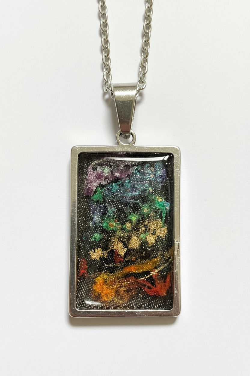 Cosmic Renewal 

One-of-a-Kind Stainless Steel Energy Pendant