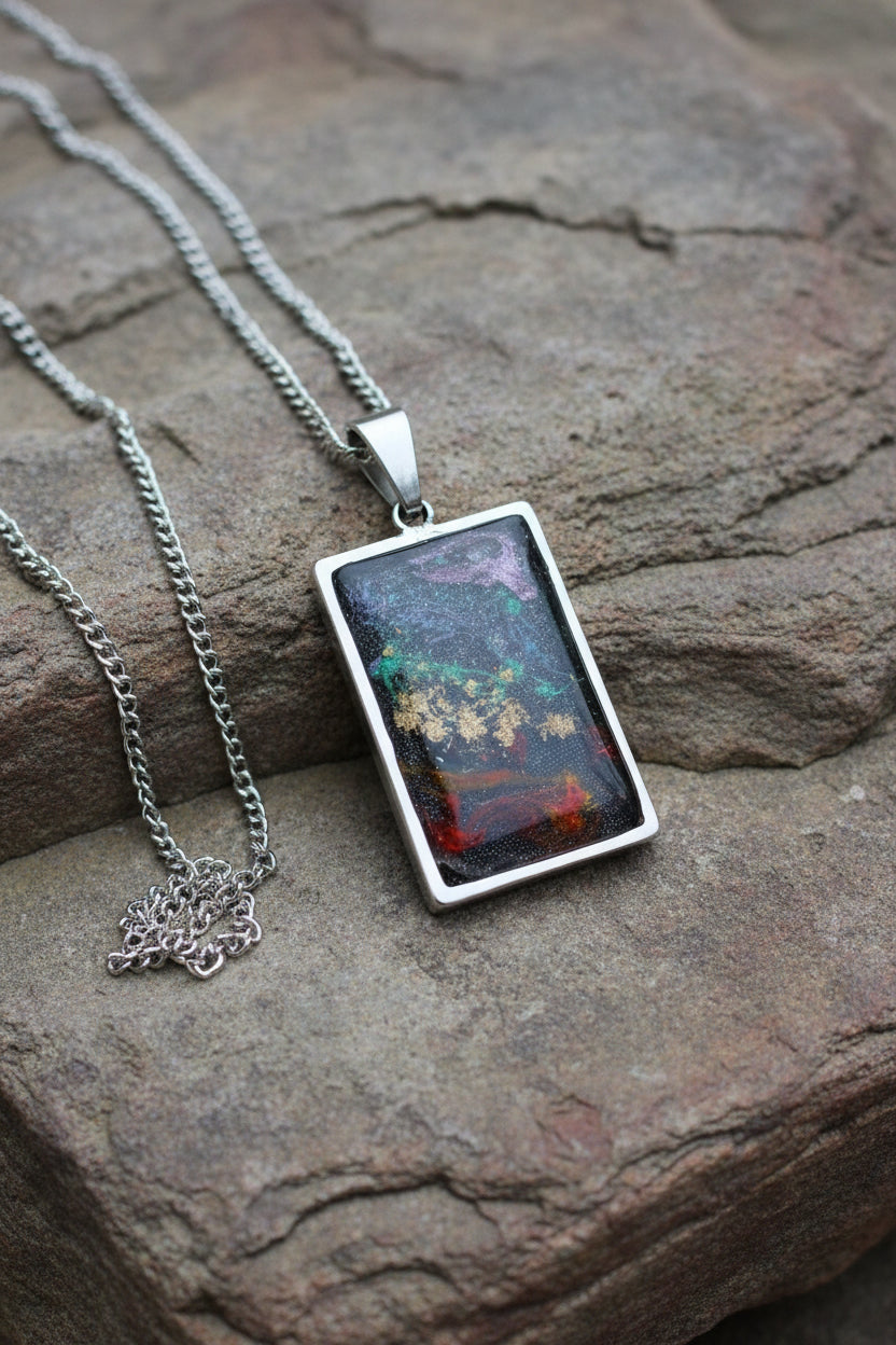 Cosmic Renewal 

One-of-a-Kind Stainless Steel Energy Pendant